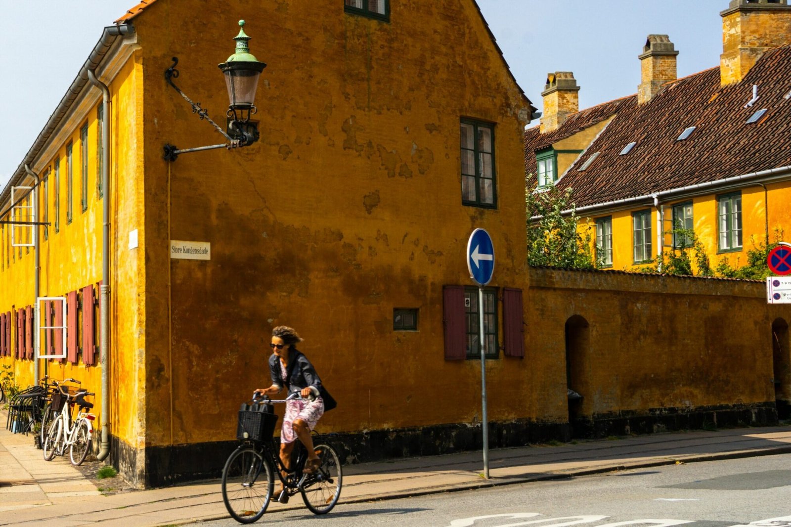 A person riding a bike down a street