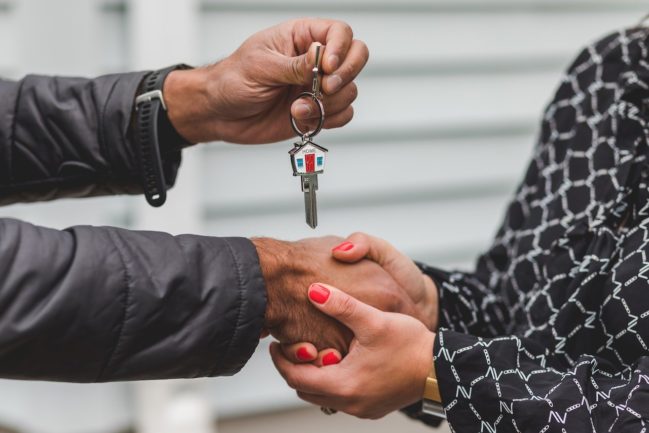 Foreign homebuyers receiving the keys to their new property in Calpe, Spain.