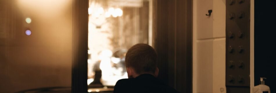 a man sitting in front of a laptop computer