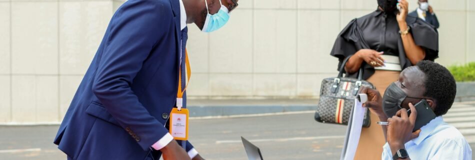 a man wearing a face mask and talking on a cell phone