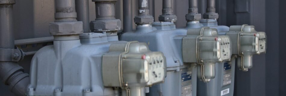 a row of water pumps sitting next to each other