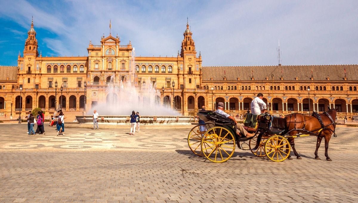 Plaza de España in Seville, Spain, featuring a fountain, historic architecture, and a horse-drawn carriage.