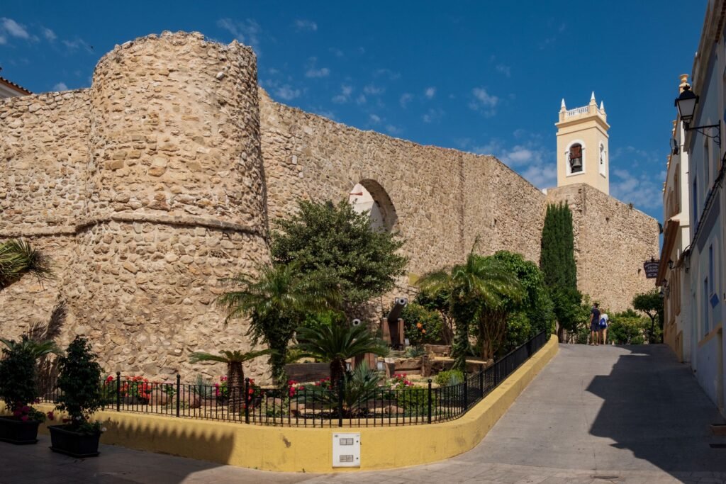 "Image of Torreó de la Peça in Calpe Spain Old Town, showcasing the historic medieval tower with ancient stone architecture and a scenic backdrop."





