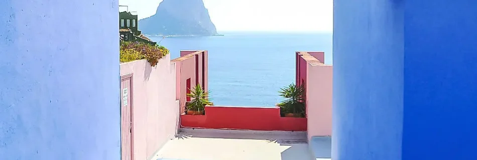 Scenic view of affordable houses in Calpe Spain with Mediterranean coastal charm and iconic Peñón de Ifach.