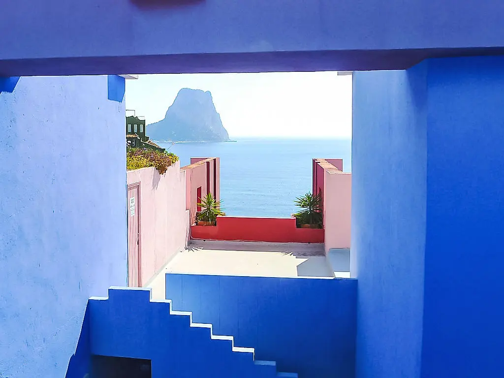Scenic view of affordable houses in Calpe Spain with Mediterranean coastal charm and iconic Peñón de Ifach.